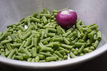 Green beans are unripe pods of bean plants (Phaseolus species), harvested young, eaten whole—tender, crisp, versatile in cooking