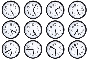 Collection of 12 round wall clocks displaying  05:00 to 05:55 or 17:00 to 17:55 on a clean white...
