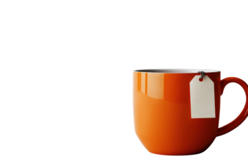A warm orange mug of tea perfect for a relaxing moment sits on a white surface with a blank tag