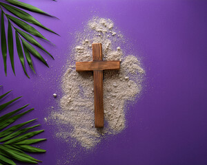 A religious flat lay composition for Ash Wednesday that includes palm leaves, ashes, a wooden cross, and a purple background with text space left open.