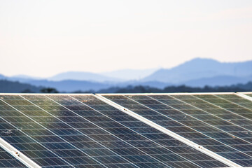 Solar panels with visible dirt and dust mounted on a rooftop. Represents the importance of maintenance for sustainable and efficient renewable energy usage.