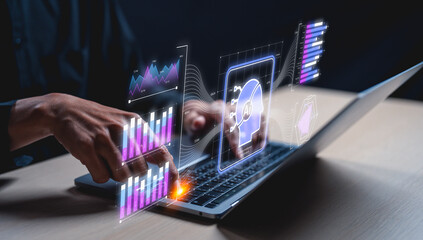 A hand businessman interacts with a laptop displaying futuristic digital graphs, AI icons, and data analytics visuals.