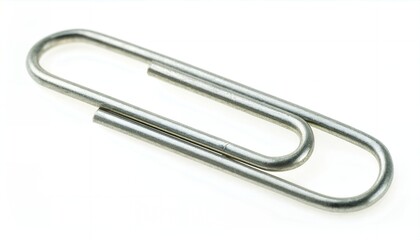 A single silver metal paperclip rests on white, its smooth looped form symbolizing office efficiency, document organization, and minimalist stationery design in everyday desk use