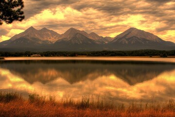 Fototapeta premium Serene mountain lake reflection at golden hour