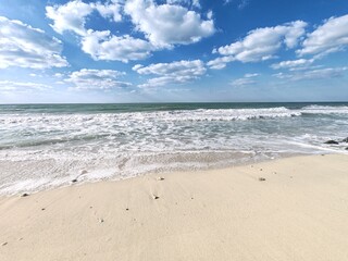 Water waves Sea Shore Beautiful Panorama white sand beach and turquoise water View.
Holiday summer beach background, Wave of sea on White sandy beach. Enjoy Holiday on Public Beach Heavy Water Waves