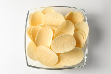 Tasty potato chips on white background, top view