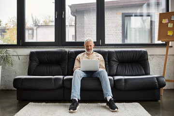Obraz premium Engaging in productive remote work from a cozy office space with a laptop