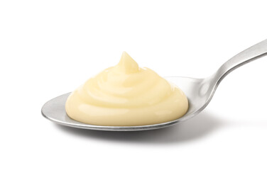 Tasty vanilla pudding in spoon isolated on white