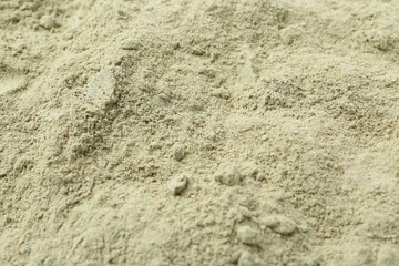 Superfood. Light green powder as background, closeup