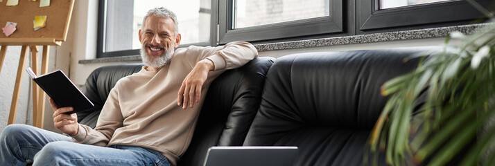 Bright, creative workspace with a man leisure and inspiration everywhere
