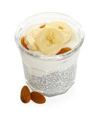 Delicious dessert with chia seeds, yogurt, banana and almond in glass on white background. Superfood