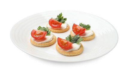 Tasty crackers with cream cheese, tomatoes and parsley isolated on white