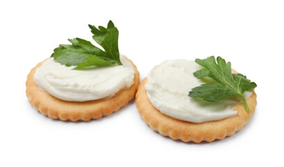 Tasty crackers with cream cheese and parsley isolated on white