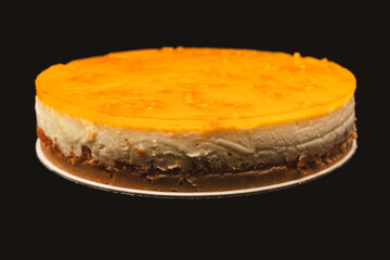 Orange cheesecake isolated on a white background.