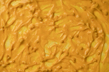 Yellow sauce splashes as a background.