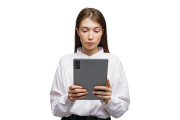 Fototapeta premium Engaging young woman studies intently on a tablet device in a minimalistic white setting