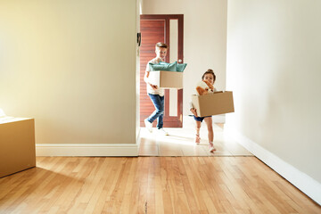 Real estate, children and walking with boxes in new home for family property, mortgage investment and security. Front door, people or relocation to dream house for fresh start, moving in or insurance