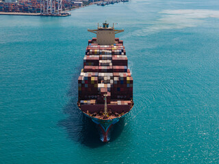 Large cargo ship transporting colorful containers across ocean