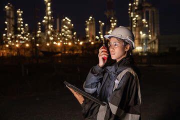 Engineers Conducting Night Inspection at Refinery