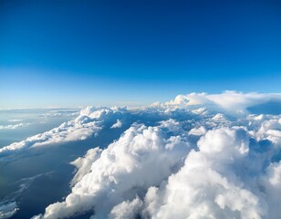 white clouds on blue sky background close up cumulus clouds high in azure skies beautiful aerial cloudscape view from above sunny heaven landscape bright cloudy sky view from airplane copy space
