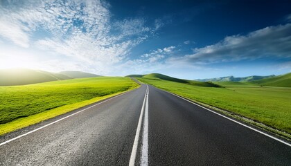 Fototapeta premium endless road along green grassland