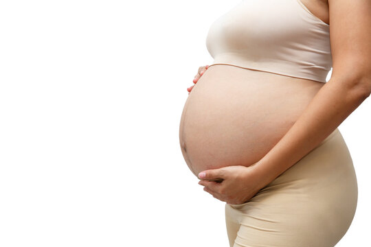 Portrait of a pregnant woman touching her big belly close up, mother, pregnancy, people and expectation. Woman holding big pregnant stomach