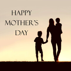 Silhouette of Walking Mother and Young Children Holding Hands at
