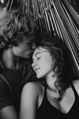 Fototapeta premium A loving couple shares a tender moment, embraced in a hammock, peaceful and in love.
