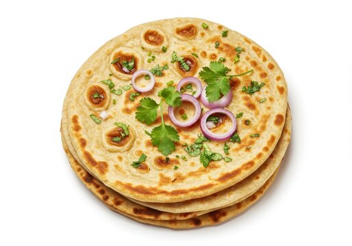 Stack of paratha flatbreads garnished with cilantro and red onion rings on white