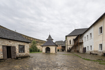 Obraz premium Fortress courtyard with historic stone buildings in Khotyn, Ukraine