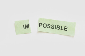 motivation message , impossible to possible torn paper