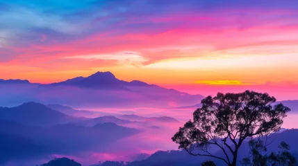 Selbstklebende Fototapeten Stunning panoramic view of vibrant sunset over mountain landscape with colorful sky and silhouetted tree in foreground du twilight hours © saokaew
