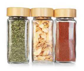 Many different aromatic spices in jars isolated on white