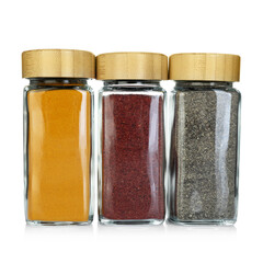 Many different aromatic spices in jars isolated on white