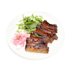 Delicious spare ribs, onion and arugula isolated on white