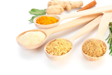 Different aromatic spices in spoons isolated on white