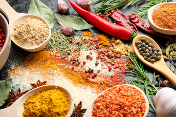 Different aromatic spices on black background, closeup