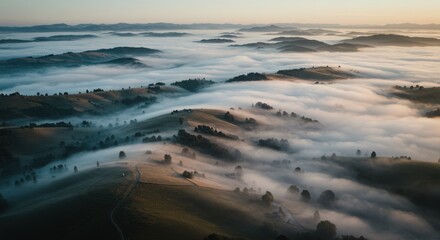 Fototapeta premium Mountains landscape with fog at sunrise aerial view