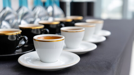Elegant coffee cups arranged on a table ready for a tasting event