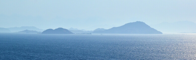 Coast with a view of small islands around Flores Island near Labuan Bajo, Indonesia