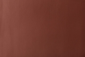 Texture of genuine leather, artificial leatherette brown background
