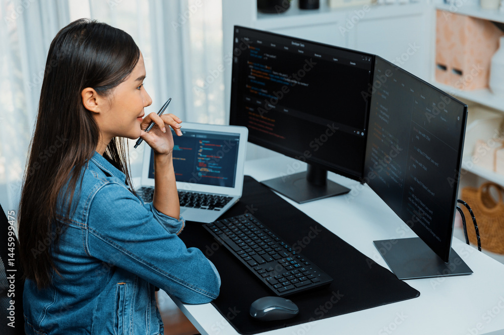 Poster young asian it developer looking online information on pc for beautiful pose with coding program dat