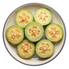 Fototapeta premium Six Slices of Feijoa Fruit in a Gray and Beige Bowl Aromatic Tropical Fruit with Sweet and Tangy Taste