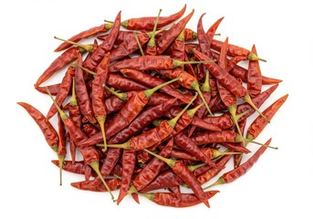 Fototapeta premium Pile of dried red chili peppers on a white background