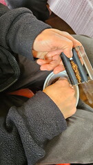 Women's hands rolling a cigarette