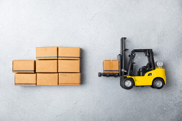 Yellow forklift and yellow truck on bright background. Logistics concept. Logistics and supply...