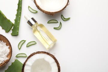 Hair treatment. Cosmetic product, coconut, butter shavings and aloe leaves on white background, flat lay. Space for text