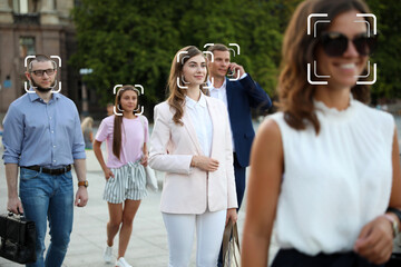 Facial recognition system identifying people on city street, selective focus