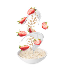 Oat flakes with fresh strawberries and splashing milk above bowl of porridge on white background