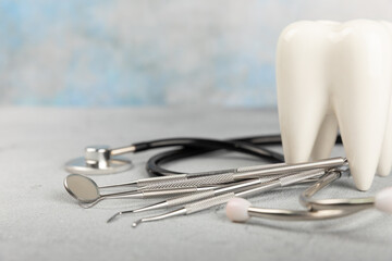 Dentist tools on a blue background. Dentist Concept.Teethcare, dental health concept. Means to care...